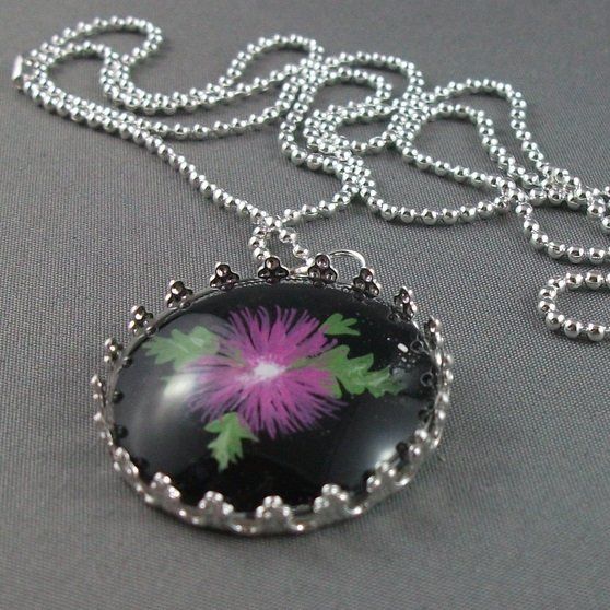 Glass pentant with purple flower